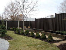 Composite fence lining residential backyard in Milton Ontario
